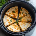 Crispy air fryer quesadilla with melted cheese and golden brown tortilla.